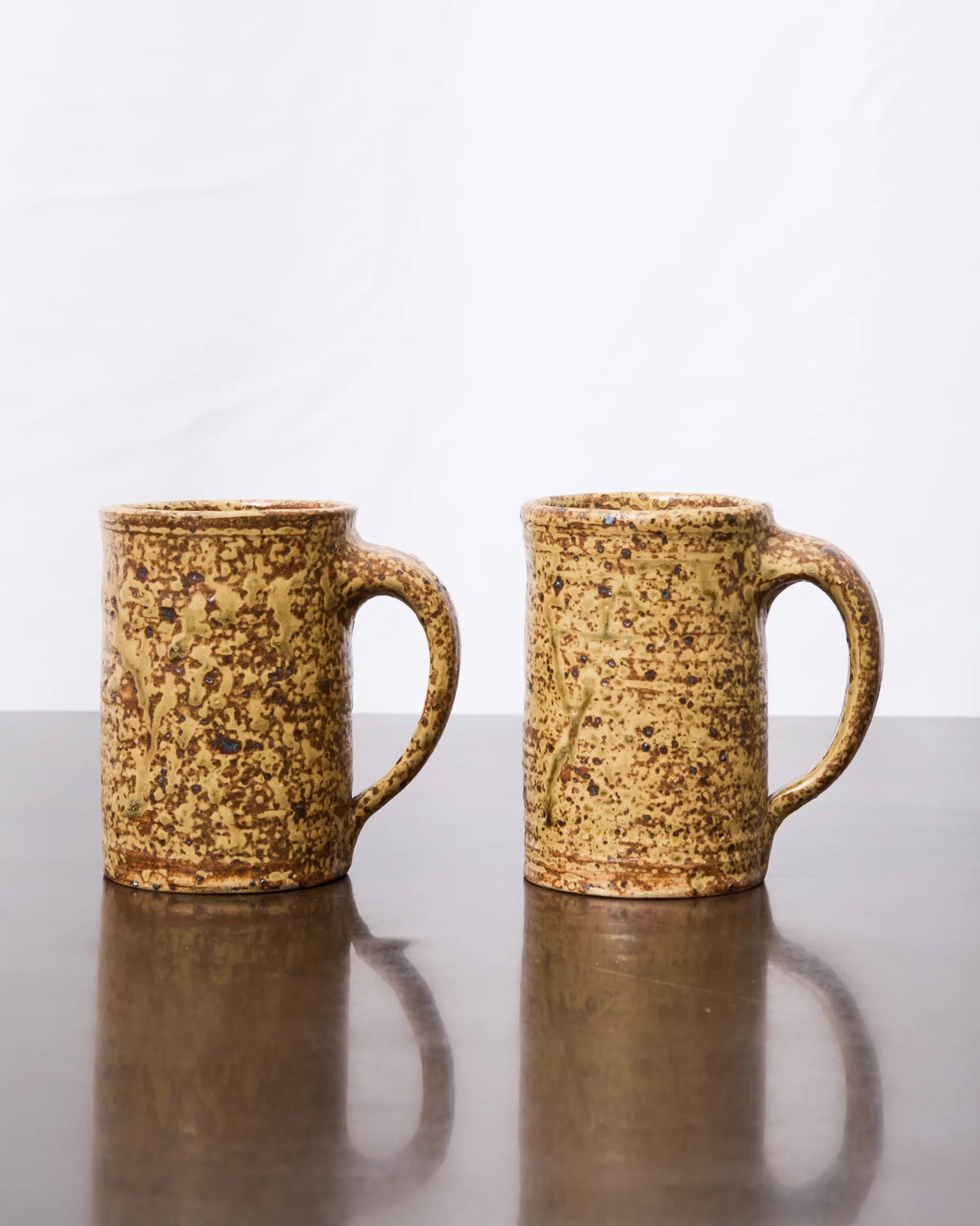 Set of two pyritized stoneware mugs (1 of 3), 1970s