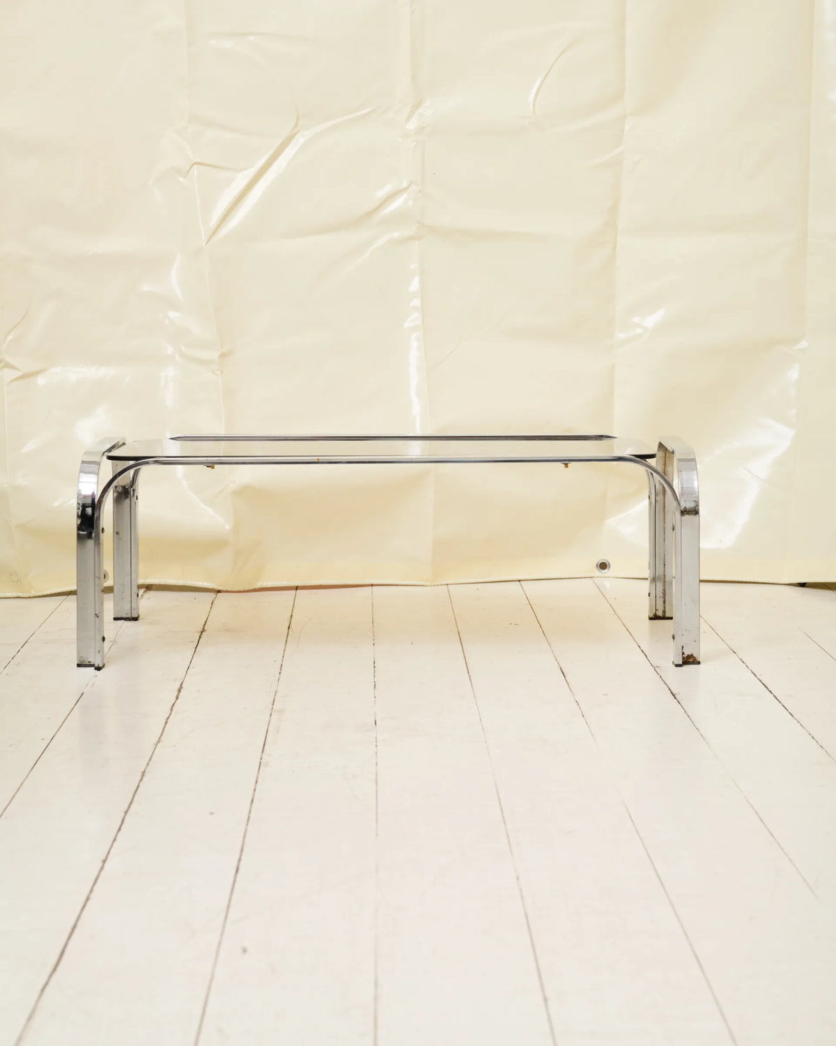 Coffee table with chrome legs and corners
