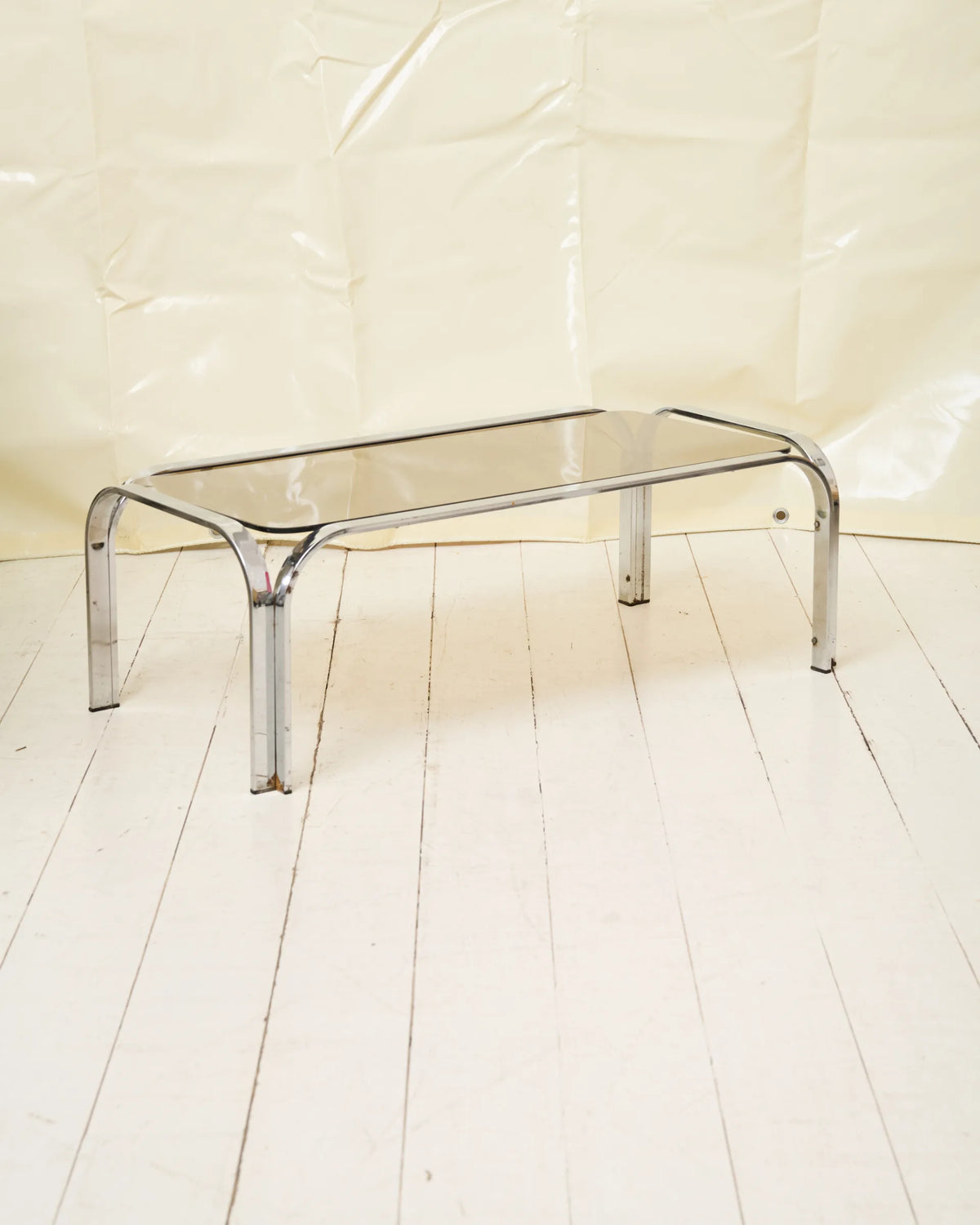 Coffee table with chrome legs and corners
