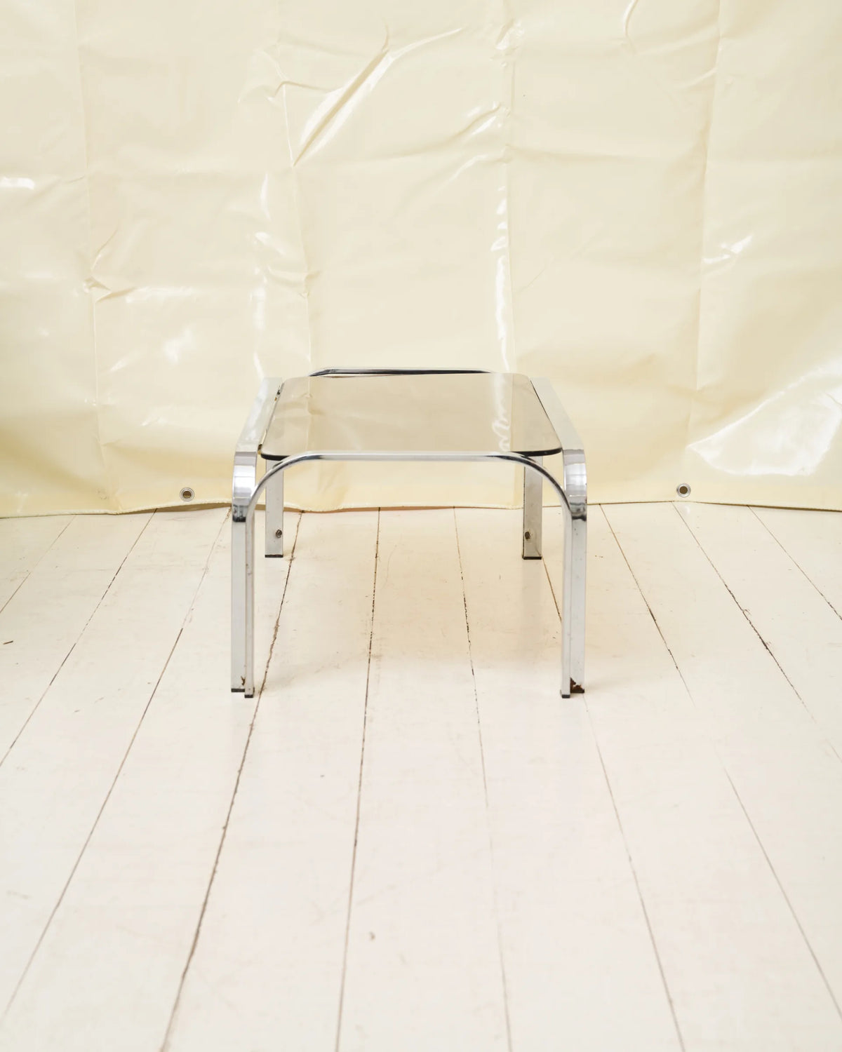 Coffee table with chrome legs and corners
