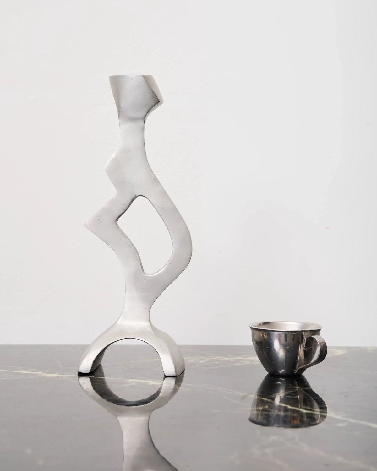 Sculptural cast aluminum candlestick, 1990s