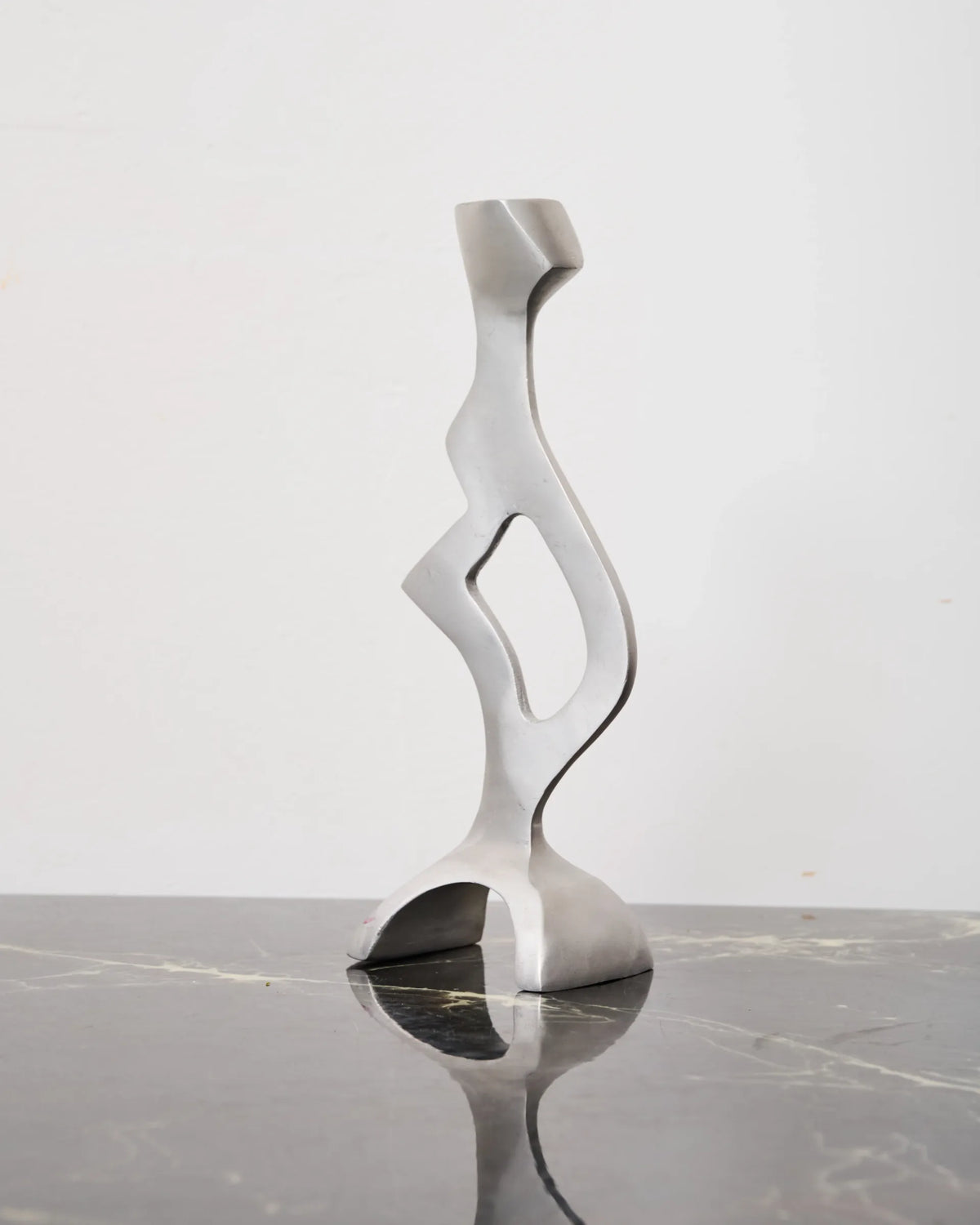 Sculptural cast aluminum candlestick, 1990s