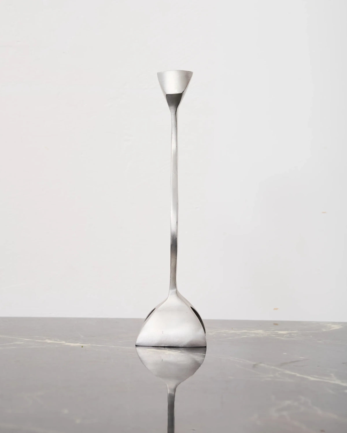Sculptural cast aluminum candlestick, 1990s