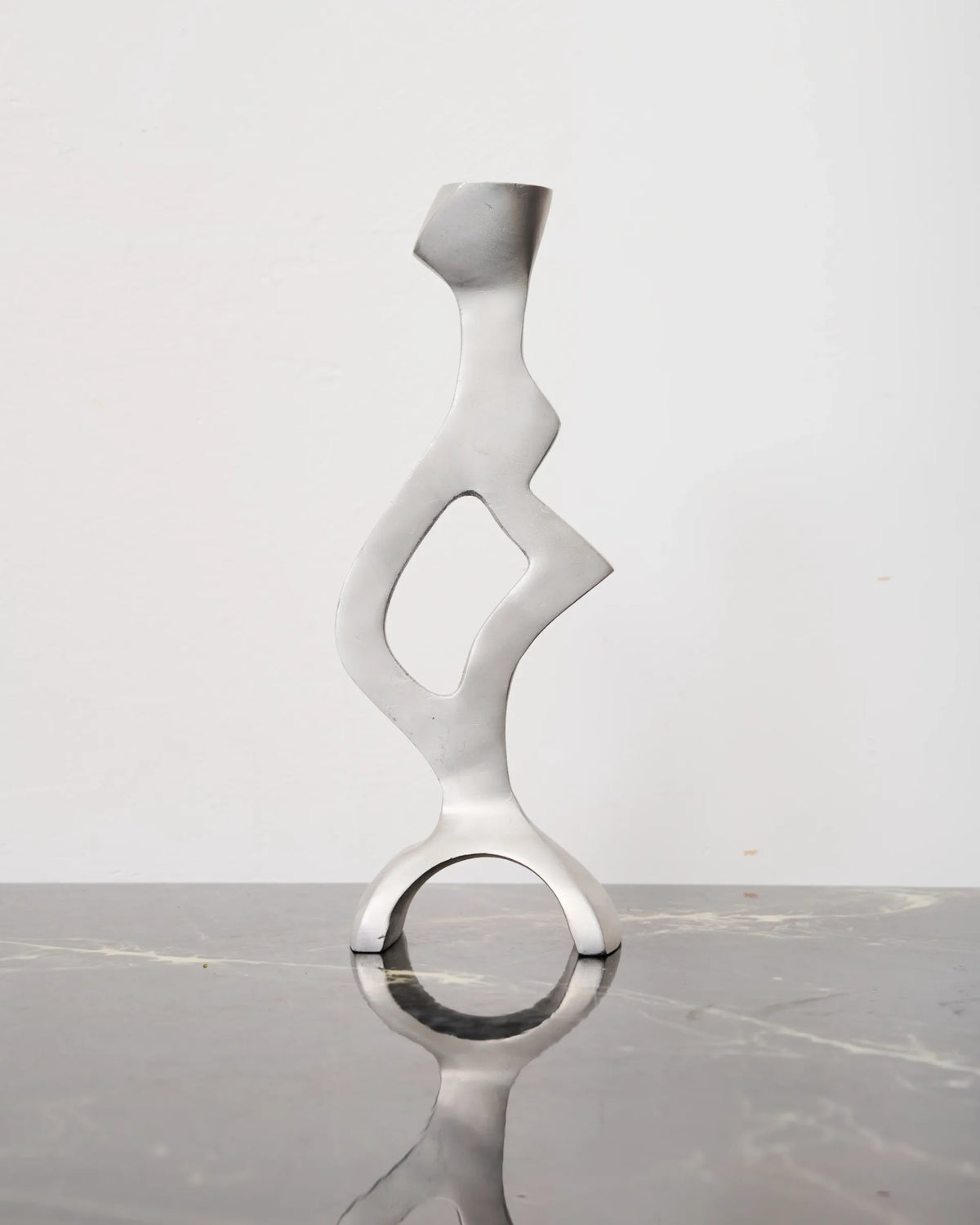 Sculptural cast aluminum candlestick, 1990s