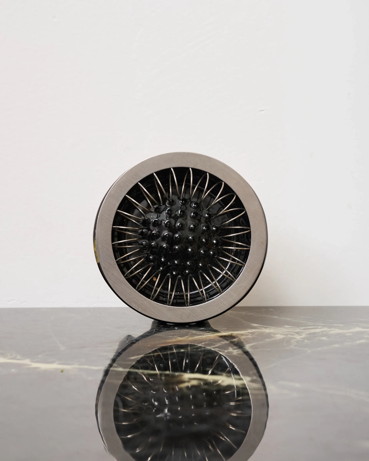 Black glazed ceramic and metal ashtray, 1980s