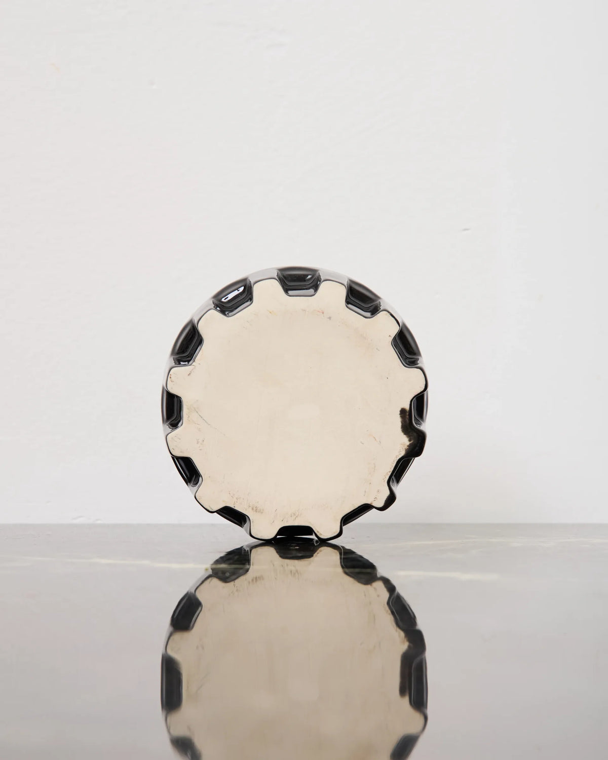 Black glazed ceramic and metal ashtray, 1980s