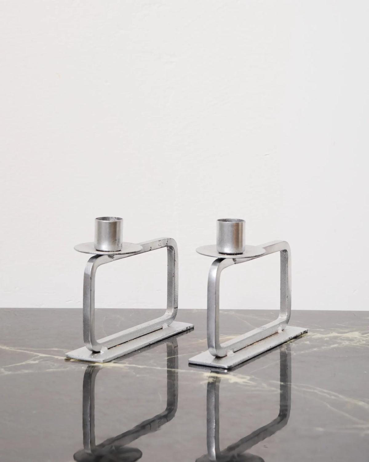 Pair of candle holders on a rectangular base, 1990s