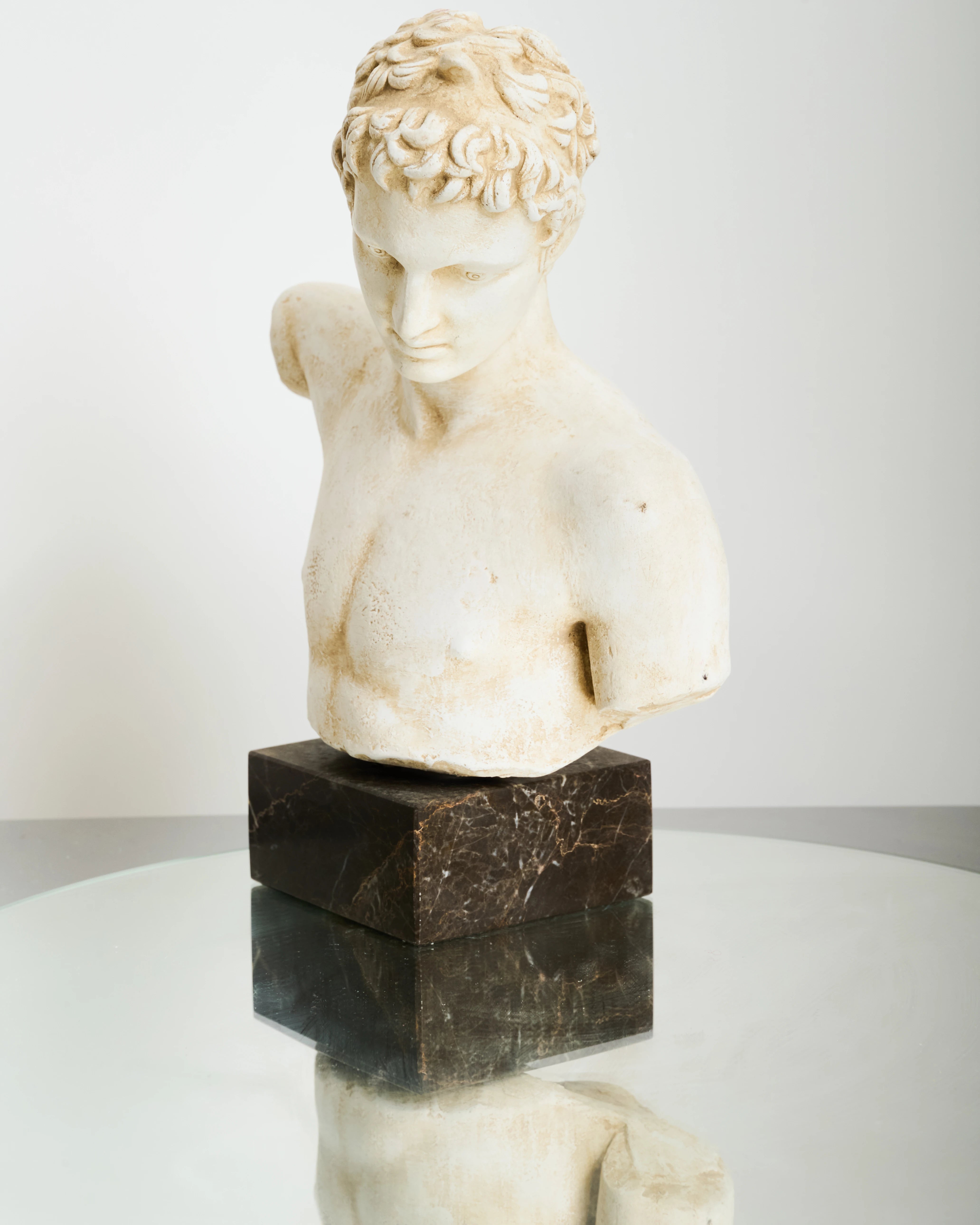 Bust of an Ephebe or Marathon Boy with a marble base, Italy