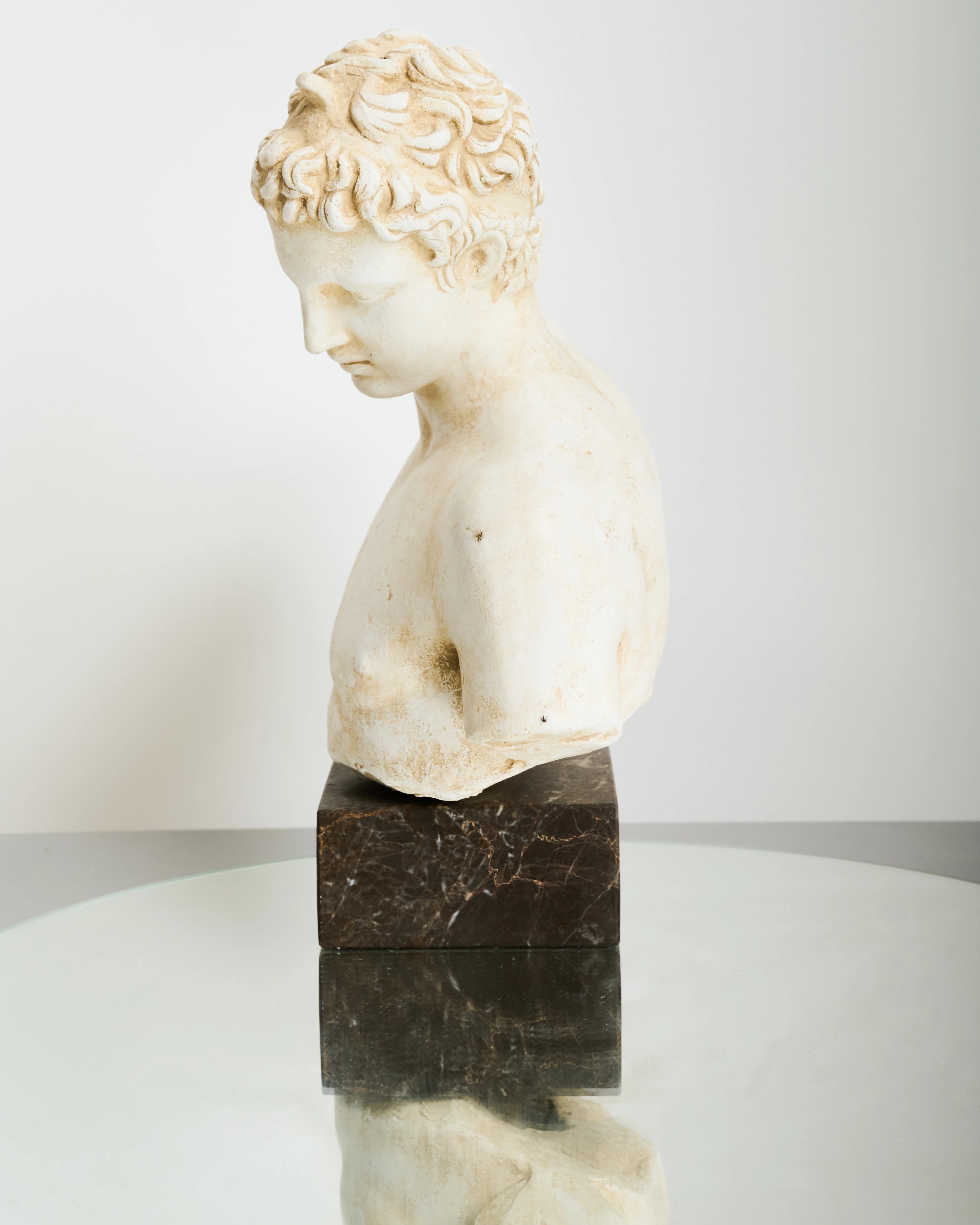 Bust of an Ephebe or Marathon Boy with a marble base, Italy
