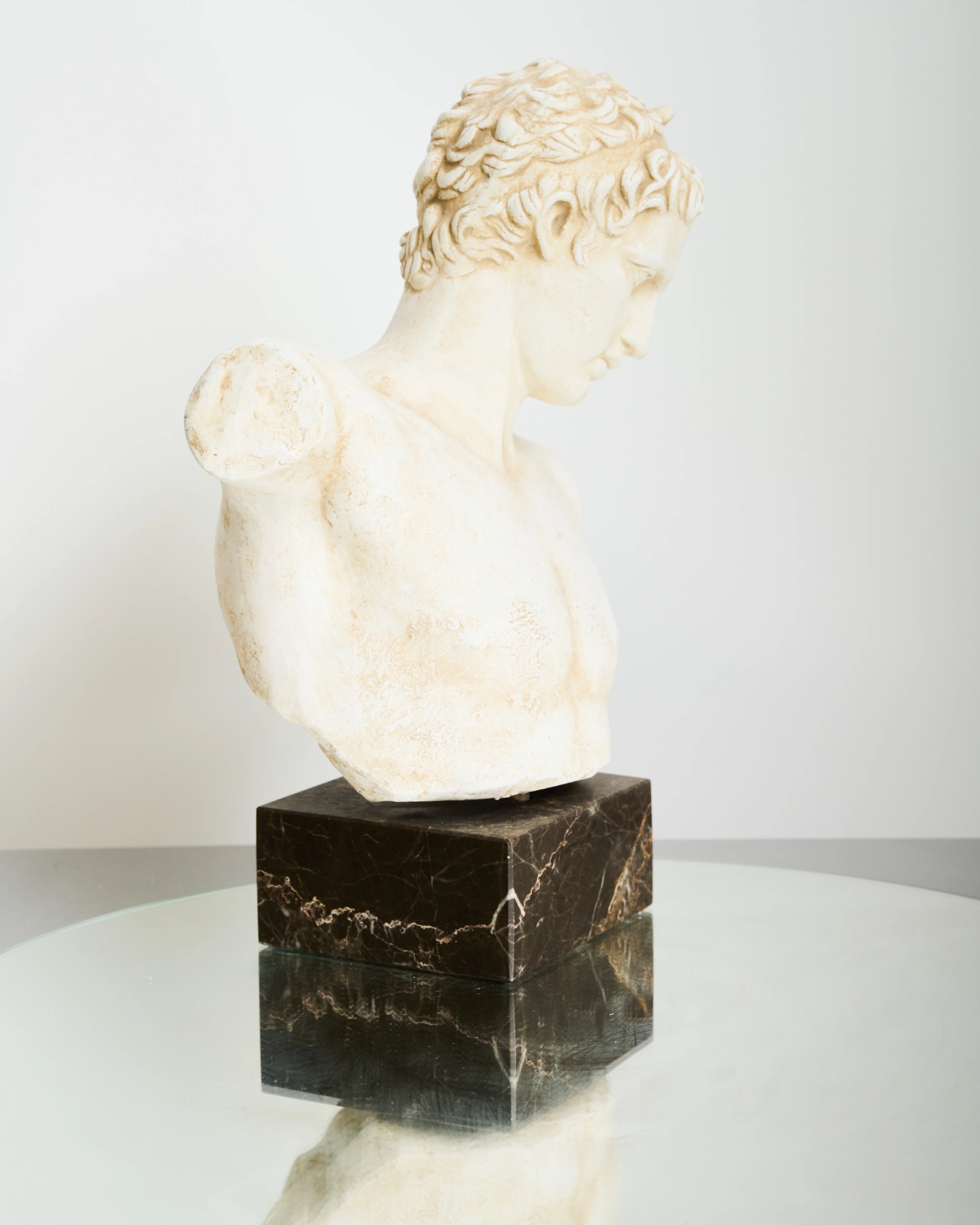Bust of an Ephebe or Marathon Boy with a marble base, Italy