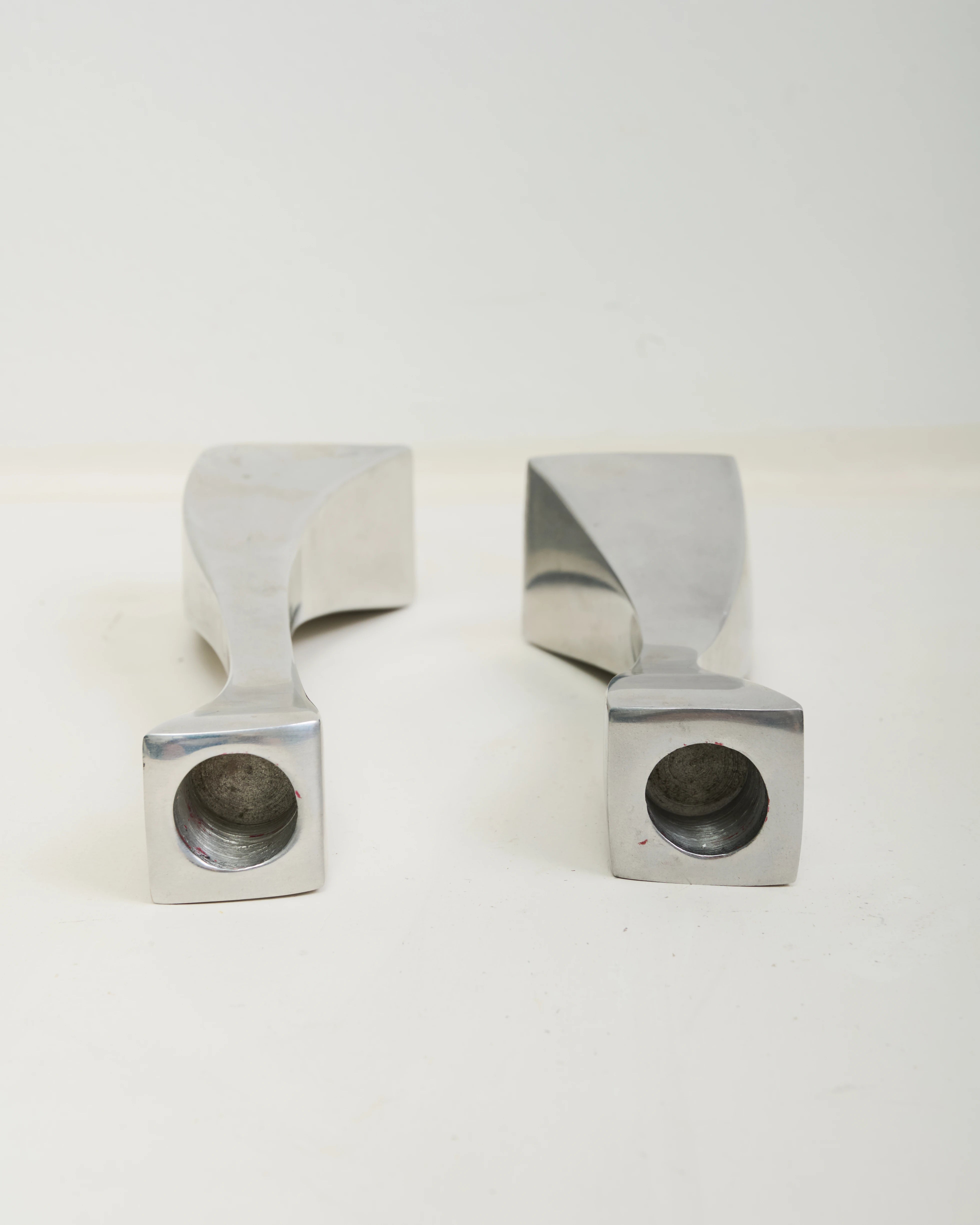 Pair of "Wave" candlesticks in cast aluminum, 1970s