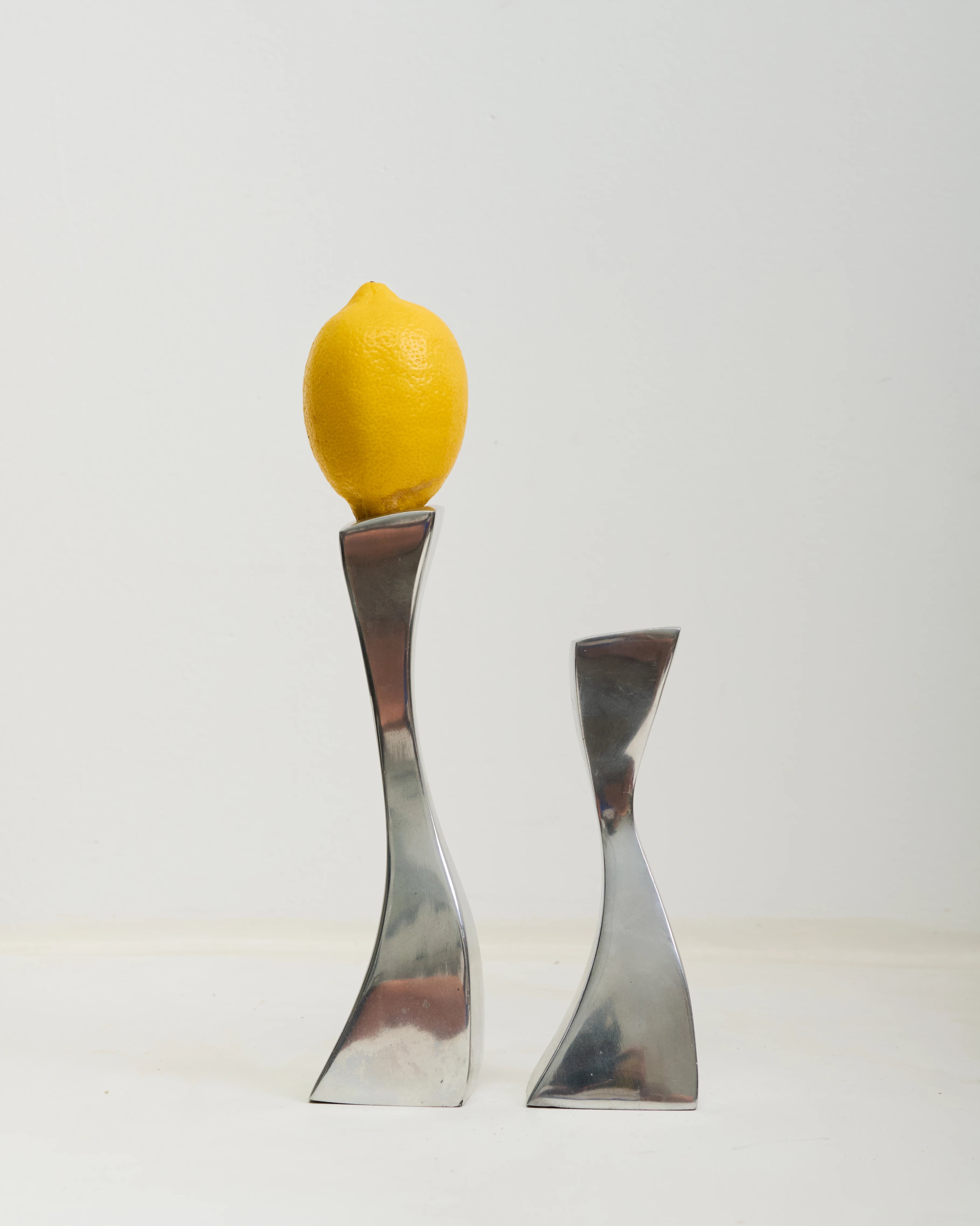 Pair of "Wave" candlesticks in cast aluminum, 1970s