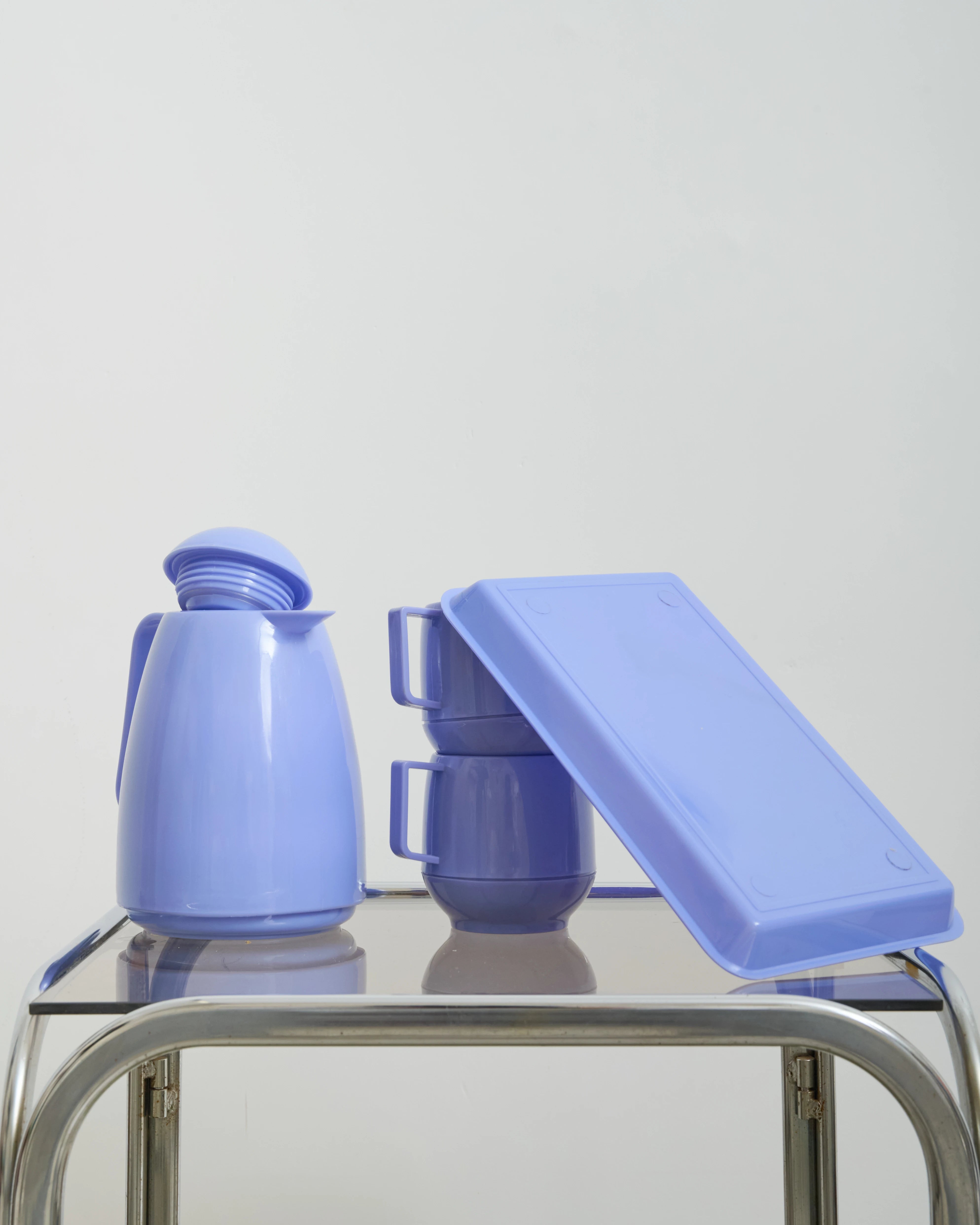 Purple plastic thermos, two cups and a tray, 1990s