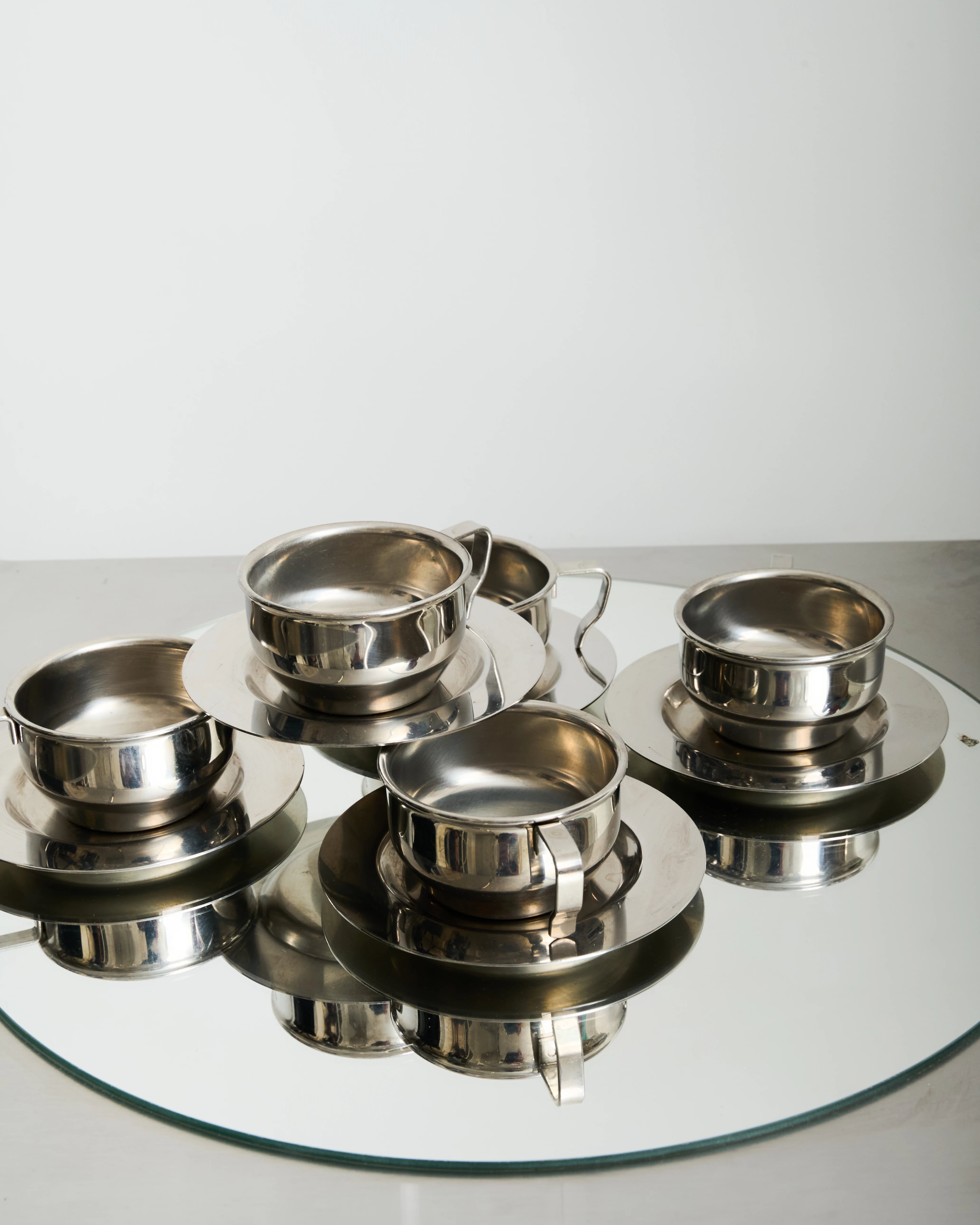 Six stainless steel bowl-shaped cups, 1980