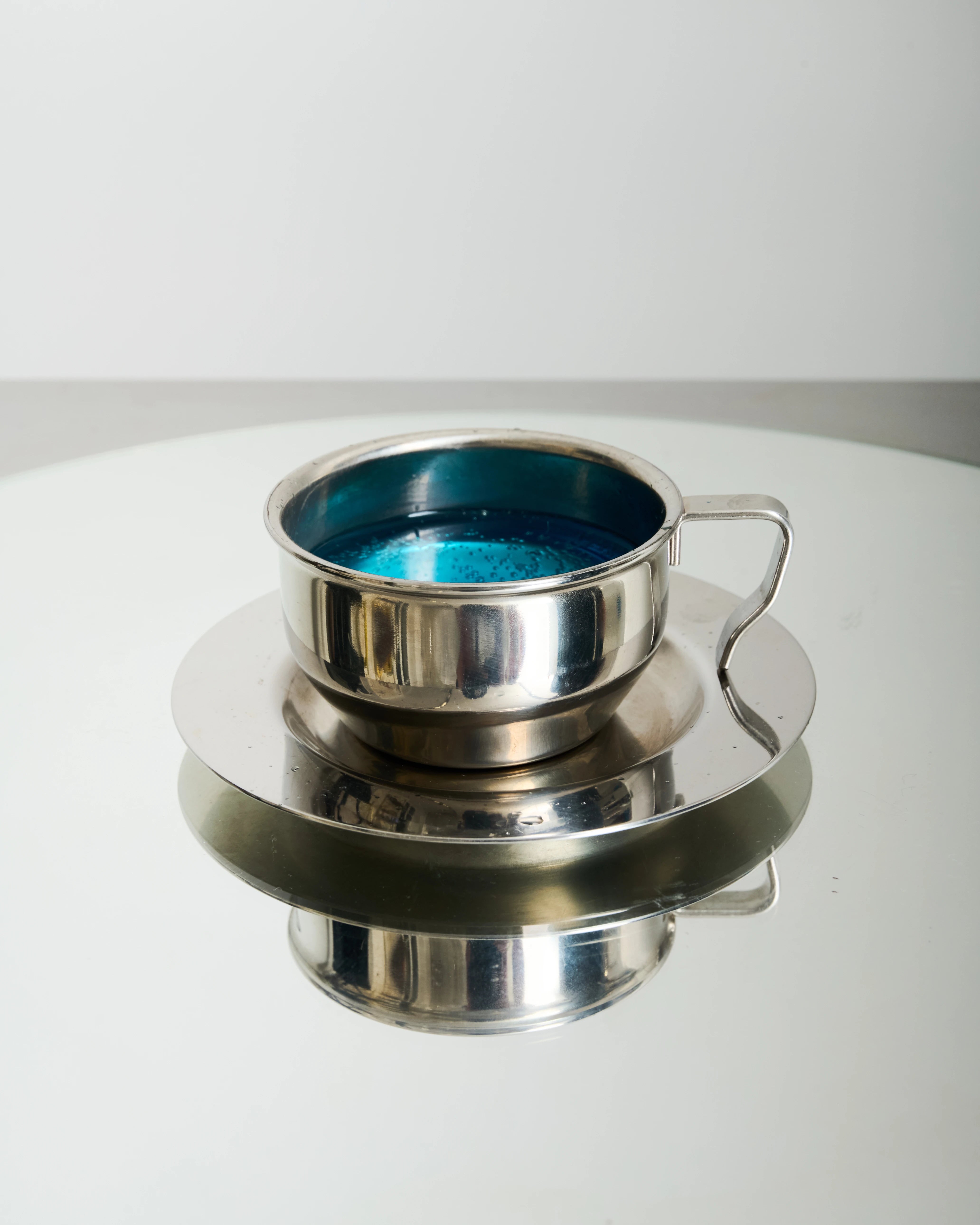 Six stainless steel bowl-shaped cups, 1980
