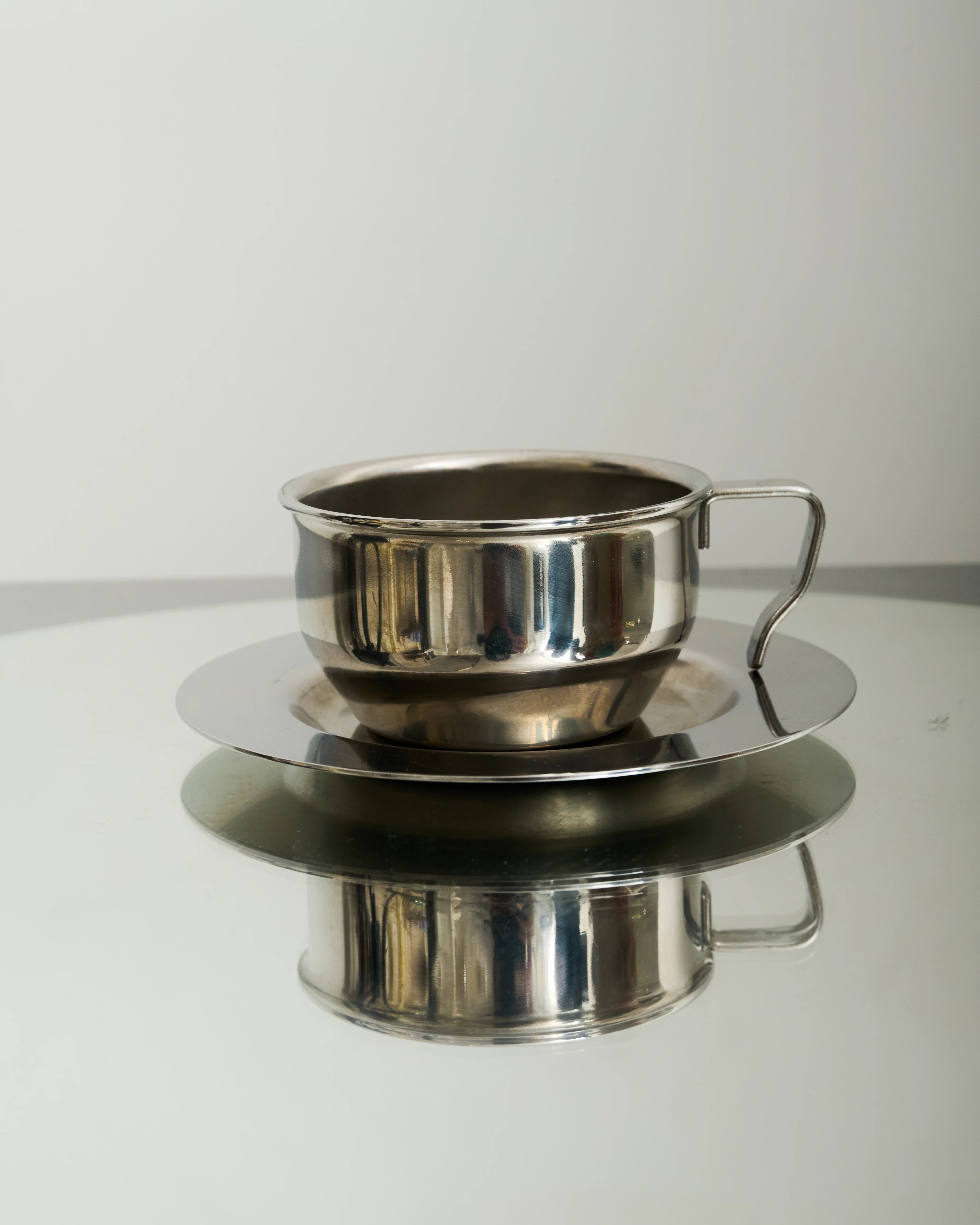 Six stainless steel bowl-shaped cups, 1980