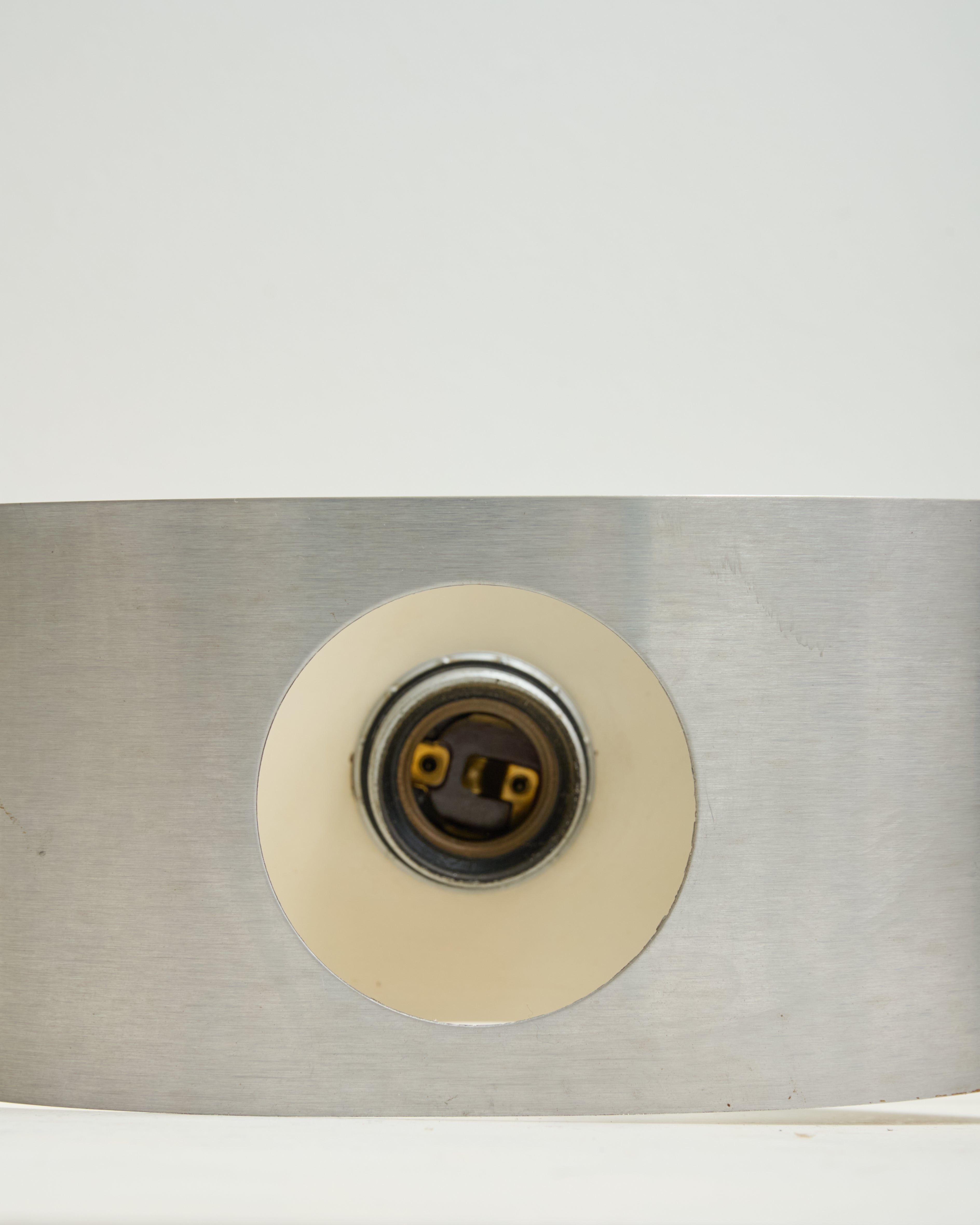 Brushed aluminum wall light, white background, 1970