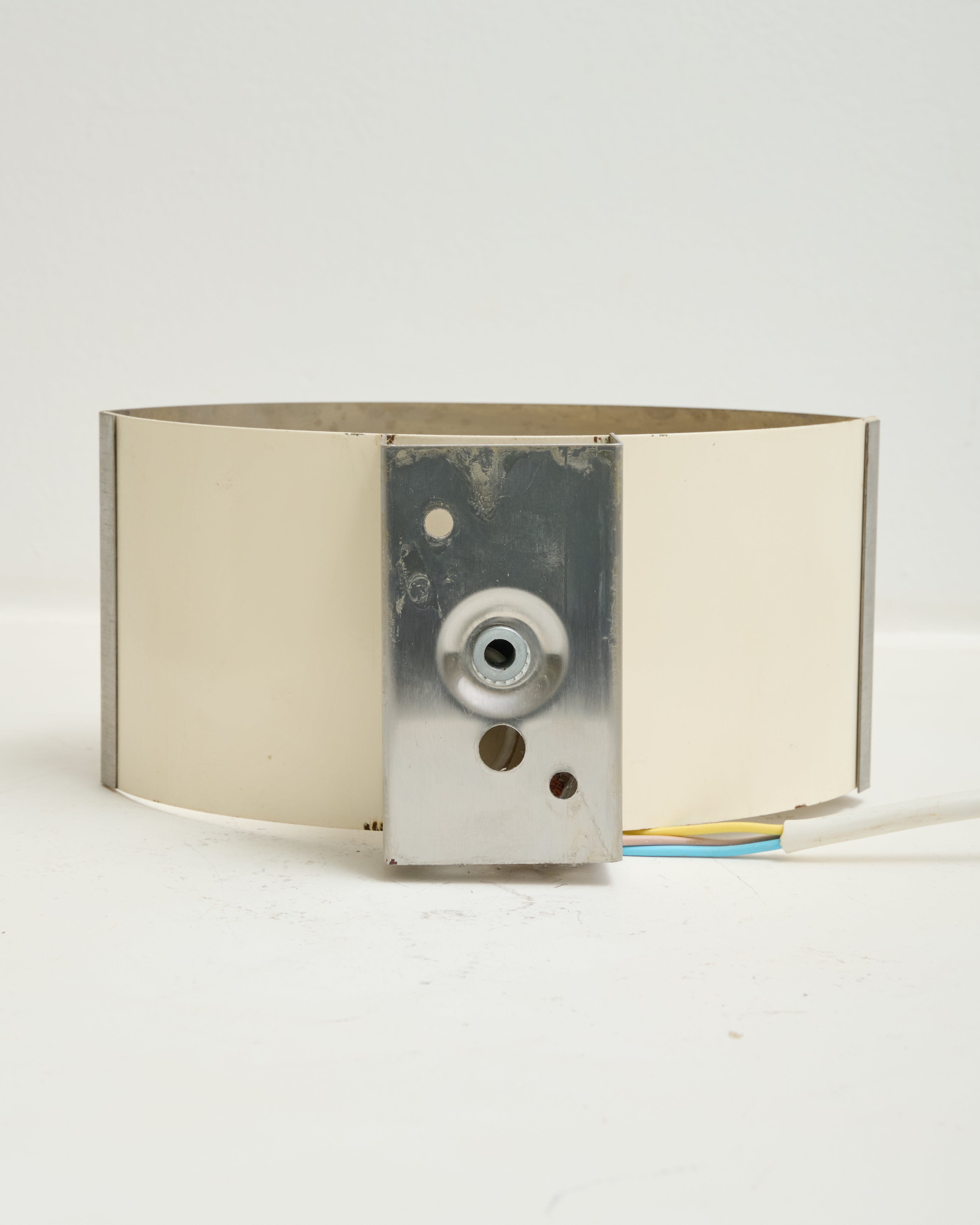 Brushed aluminum wall light, white background, 1970