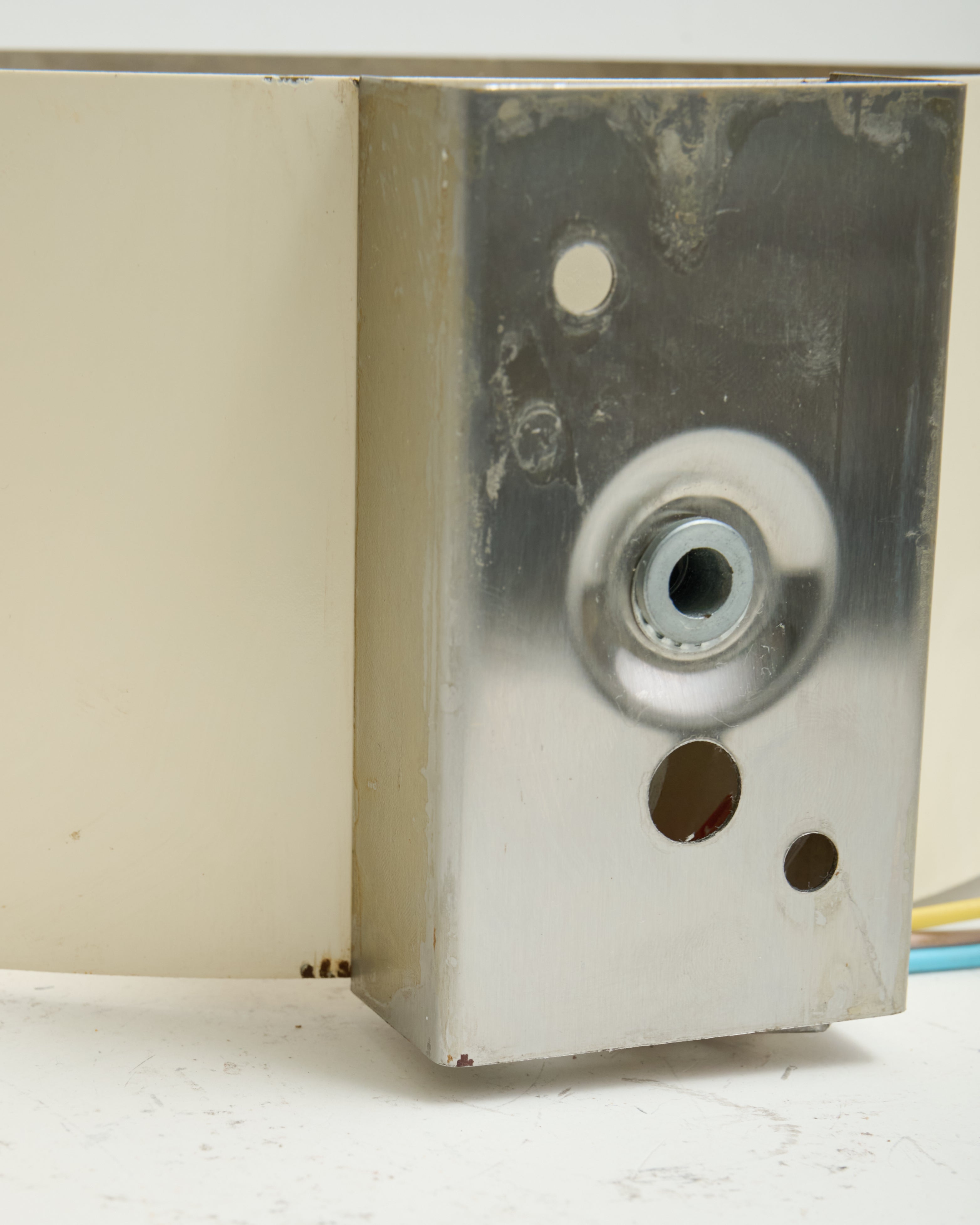 Brushed aluminum wall light, white background, 1970