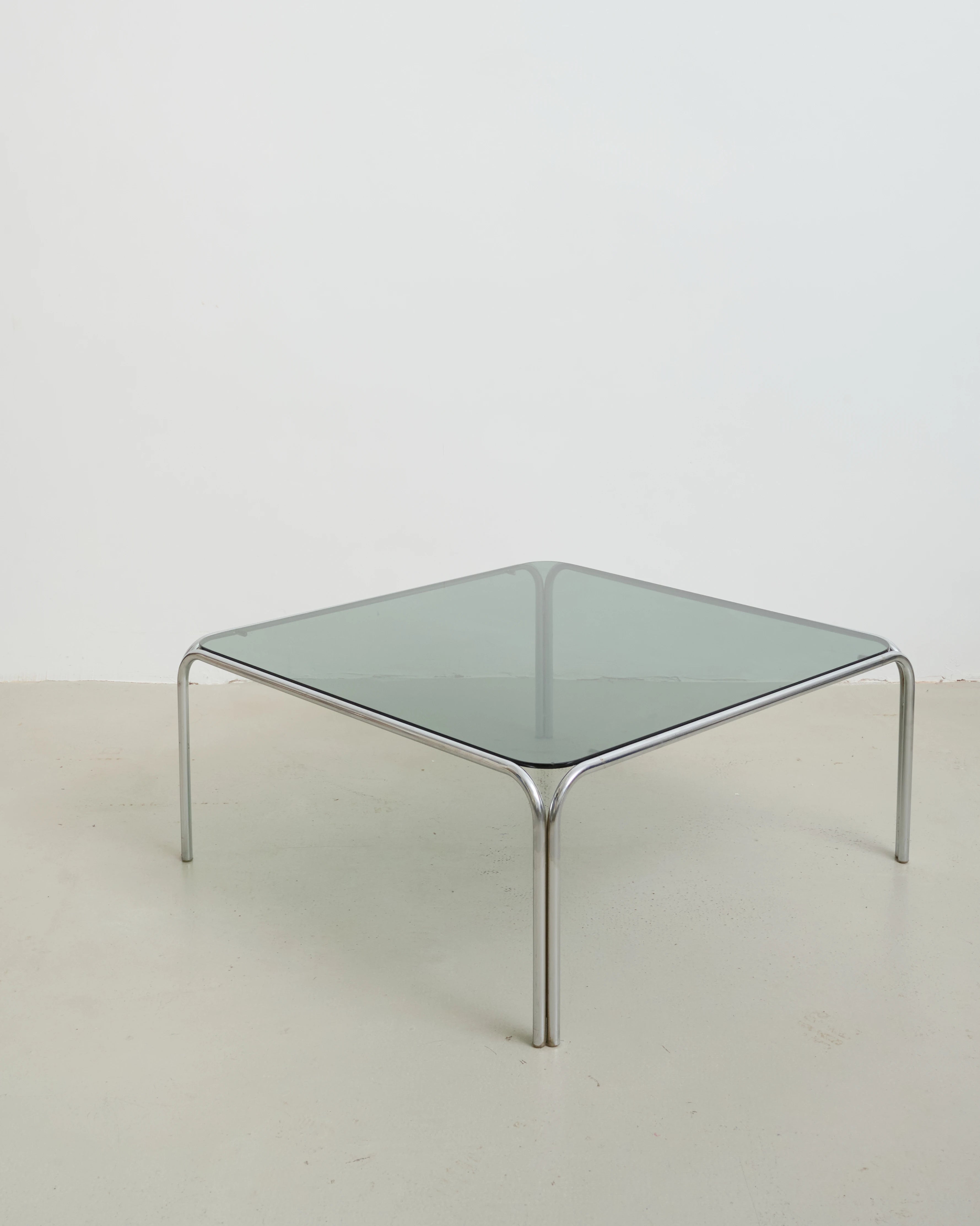 Coffee table with chrome legs and corners